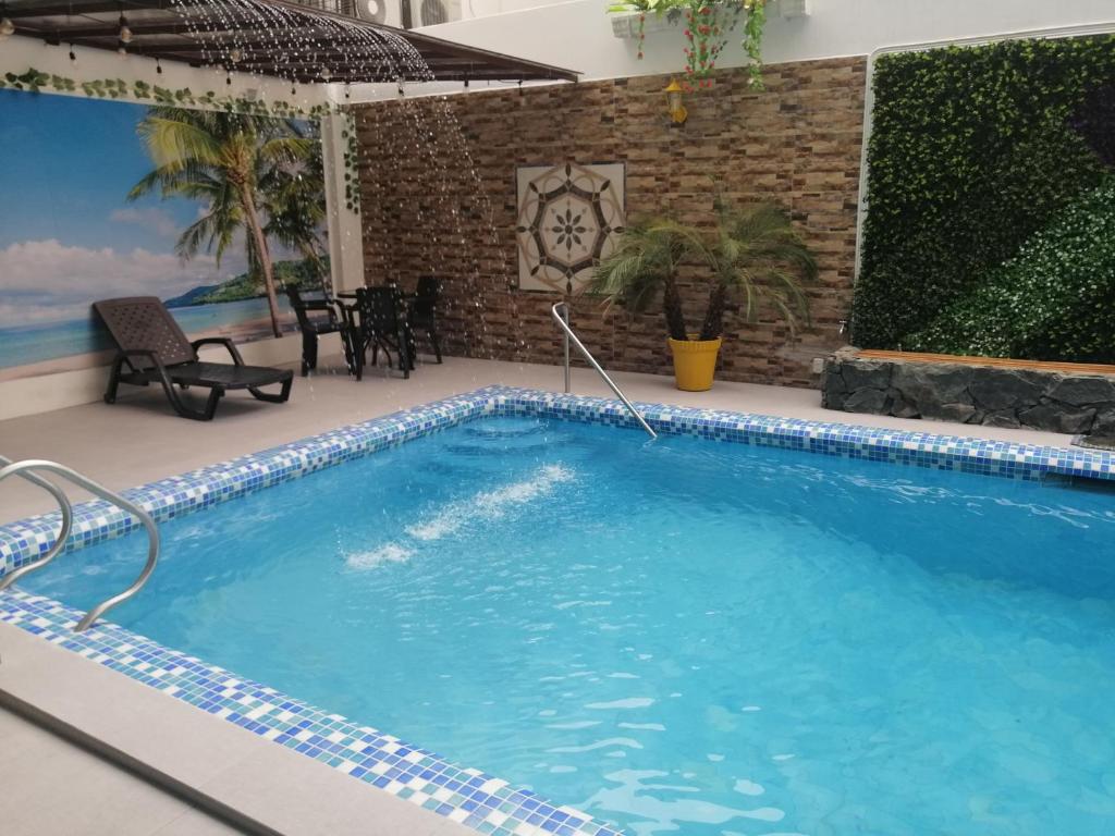 Bazén v ubytování Hostal Perla Real Inn nebo v jeho okolí