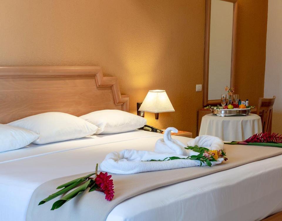 Postel nebo postele na pokoji v ubytování Tecnohotel Itzáes