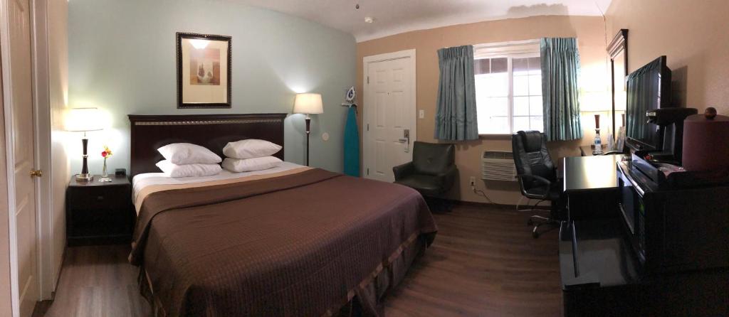 Postel nebo postele na pokoji v ubytování Value Inn Motel EUGENE AIRPORT
