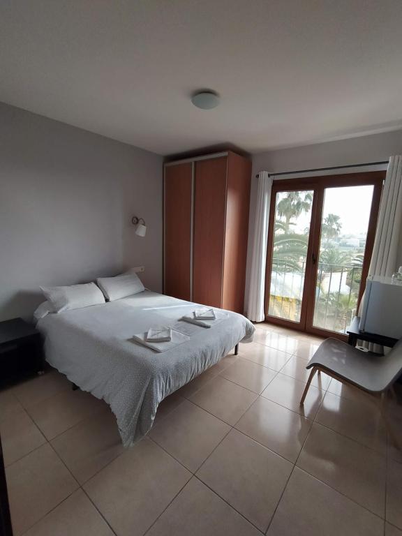 Postel nebo postele na pokoji v ubytování Hostal Gran Sol