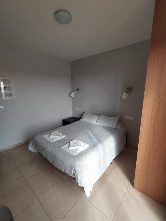 Postel nebo postele na pokoji v ubytování Hostal Gran Sol