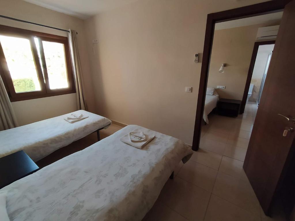 Postel nebo postele na pokoji v ubytování Hostal Gran Sol