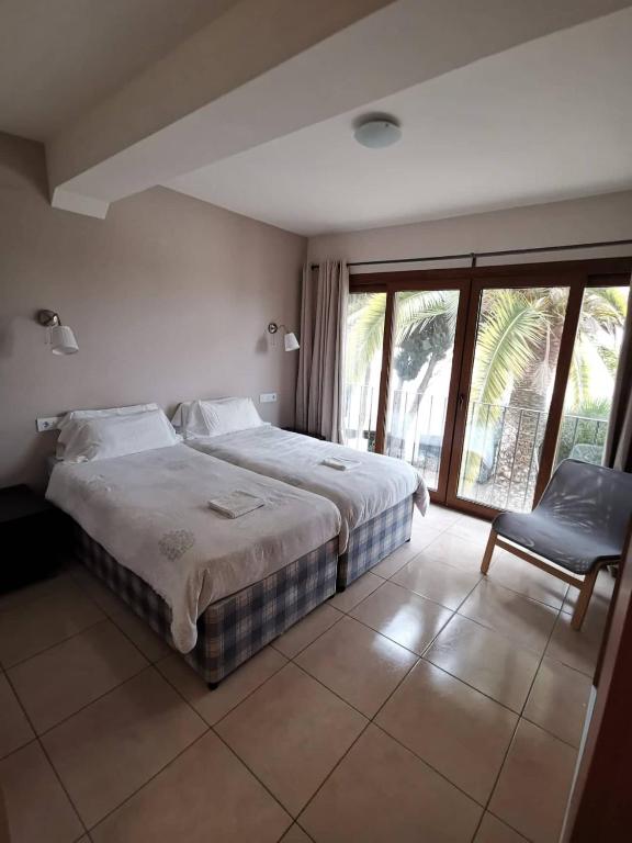 Postel nebo postele na pokoji v ubytování Hostal Gran Sol