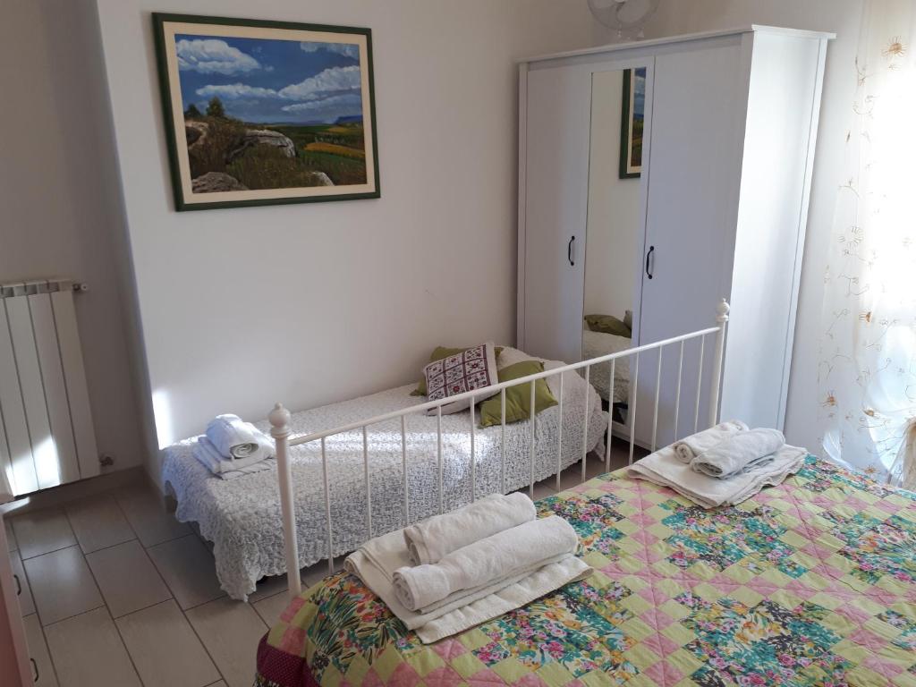 Łóżko lub łóżka w pokoju w obiekcie Bellavista - Pescara colli