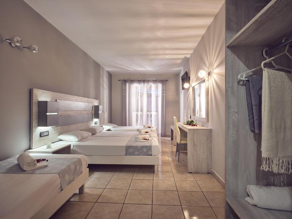 Postel nebo postele na pokoji v ubytování Savvas-Deval Hotel