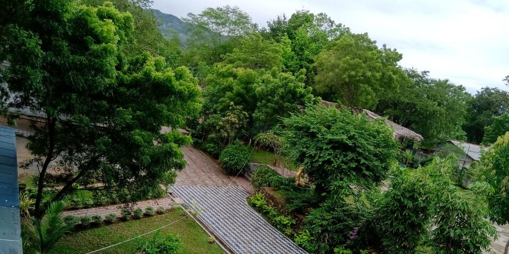 an overhead view of a garden with trees and a walkway at Leisure Port Restinn in Wellawaya