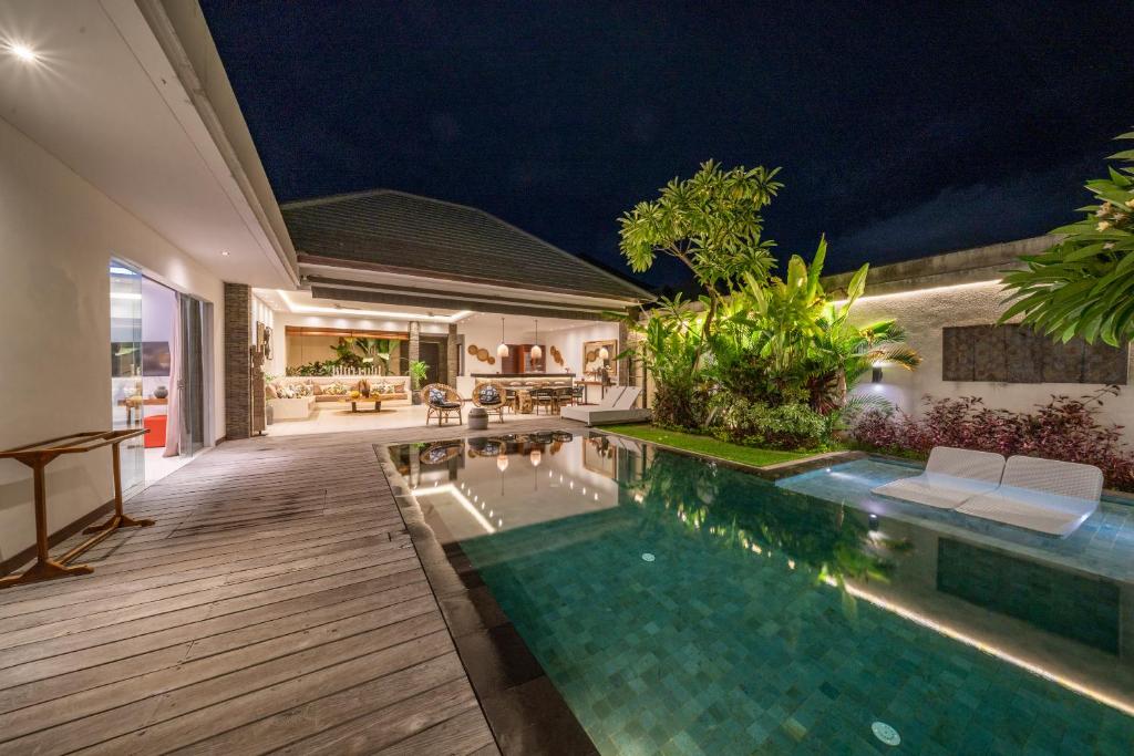 a swimming pool in a villa at night at Villa Bima - 3 Bedroom Villa in Seminyak in Seminyak