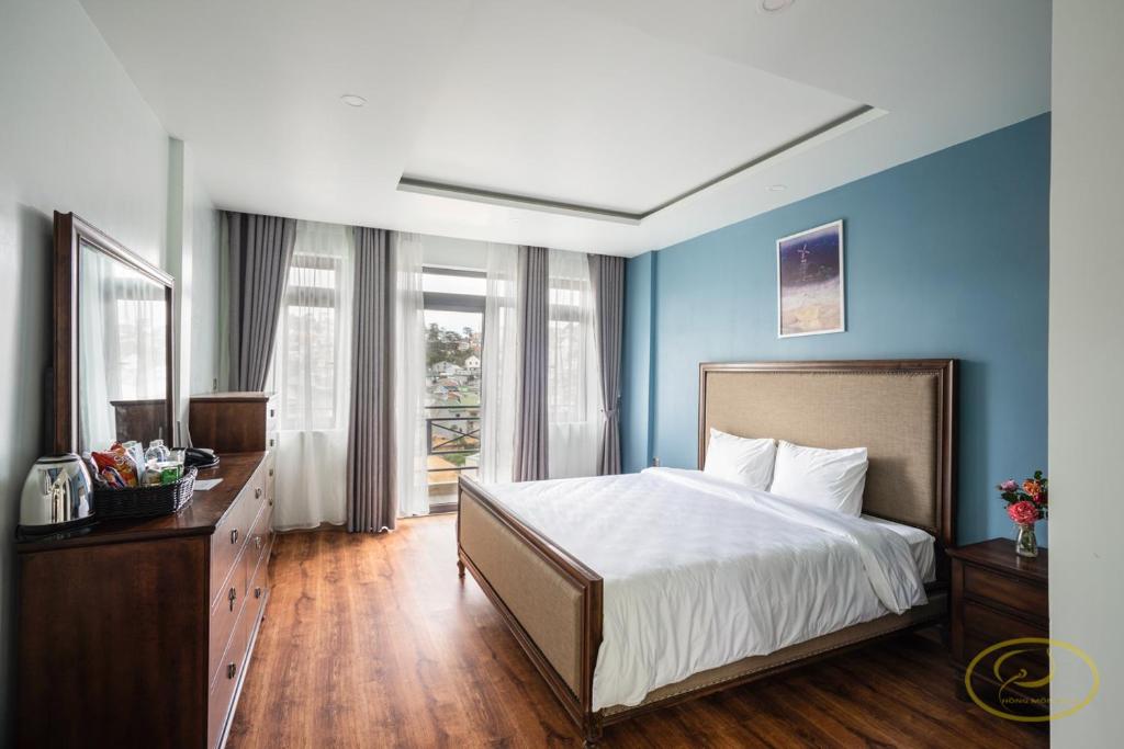 Postel nebo postele na pokoji v ubytování Hong Mon Villa