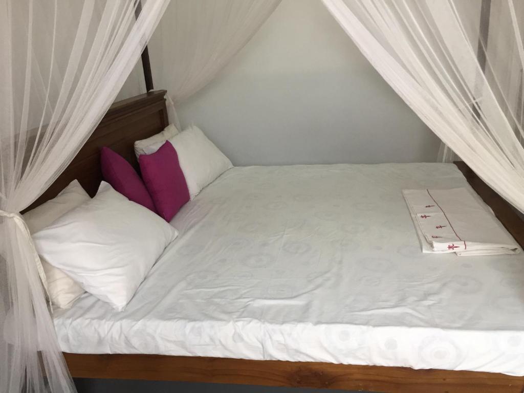 Postel nebo postele na pokoji v ubytování Diwanka Villa
