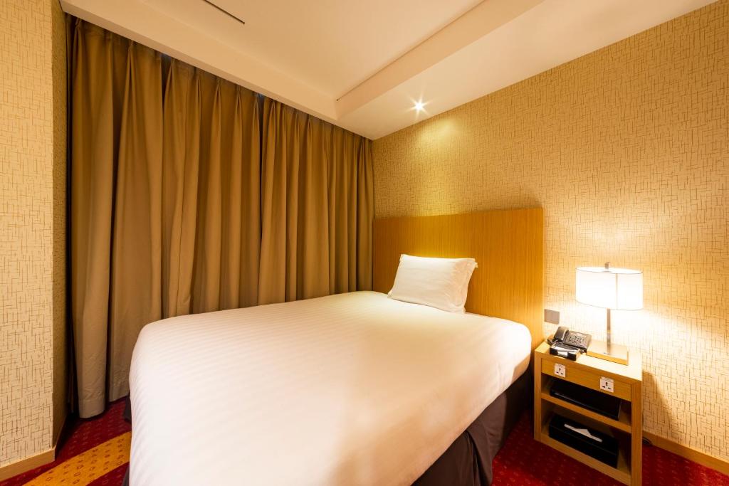 Postel nebo postele na pokoji v ubytování Solaria Nishitetsu Hotel Busan