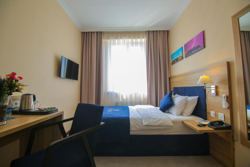 Postel nebo postele na pokoji v ubytování Rayan Hotel