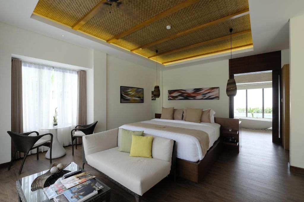 Postel nebo postele na pokoji v ubytování Kandaya Resort