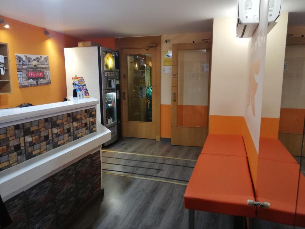 A kitchen or kitchenette at Hostal Inter Puerta del Sol AUTO CHECK IN