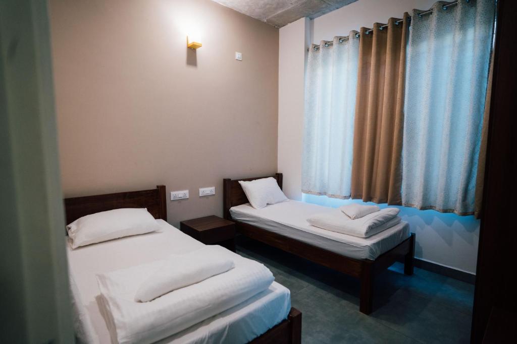 Postel nebo postele na pokoji v ubytování Draper Startup House ,Koramangala