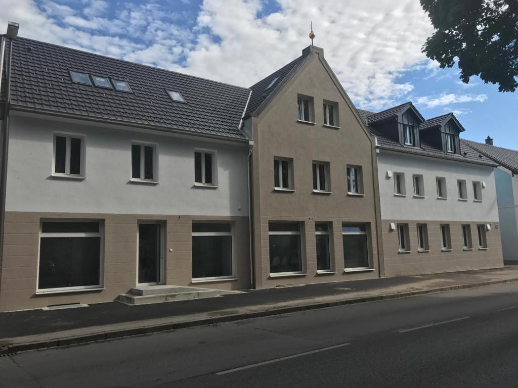 a large building on the side of a street at Frundsberg-Apartment in Mindelheim