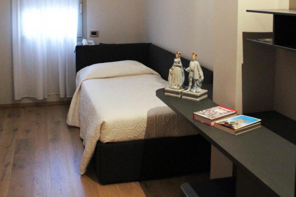Postel nebo postele na pokoji v ubytování Hotel Ristorante La Rosina