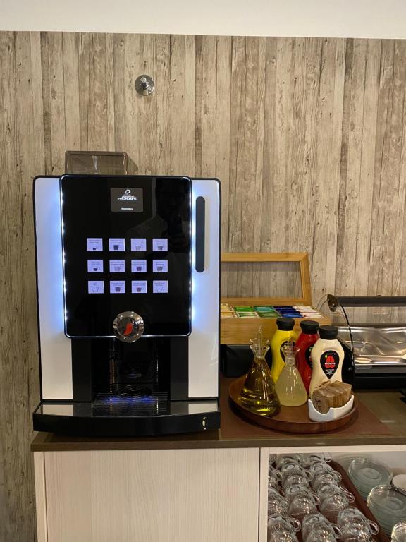 a coffee maker sitting on top of a counter at Cascais City & Beach Hotel in Cascais