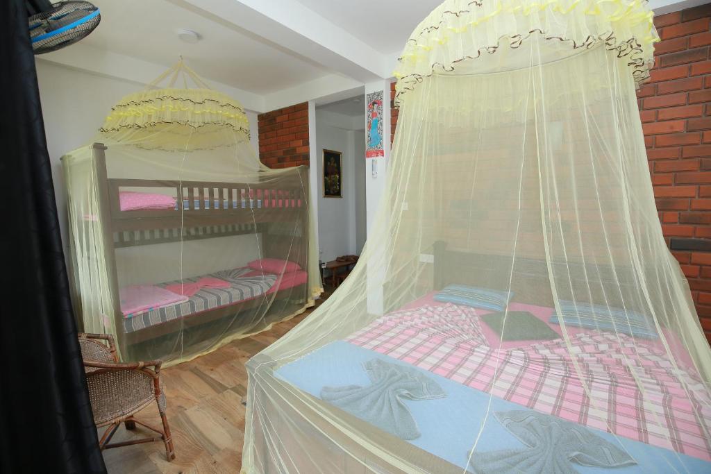 Postel nebo postele na pokoji v ubytování Rock side inn - Ella
