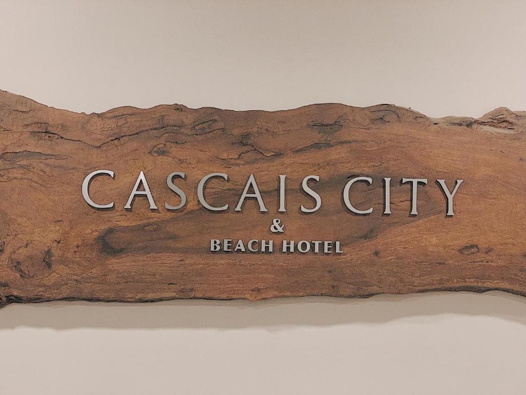 a sign for a casas city and beach hotel at Cascais City & Beach Hotel in Cascais