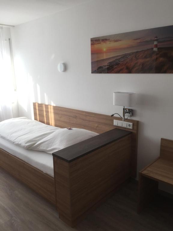 Postel nebo postele na pokoji v ubytování Hotel Post Viernheim