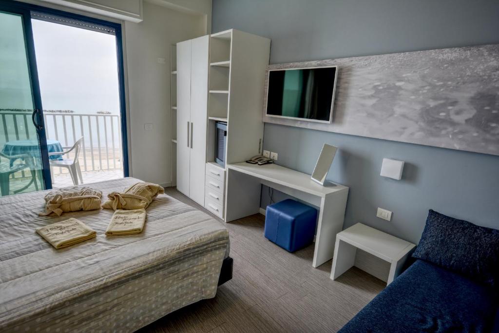 Postel nebo postele na pokoji v ubytování Hotel Royal