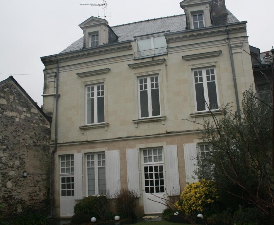 an old building with a tower on top of it at Quai St Paul in Ancenis