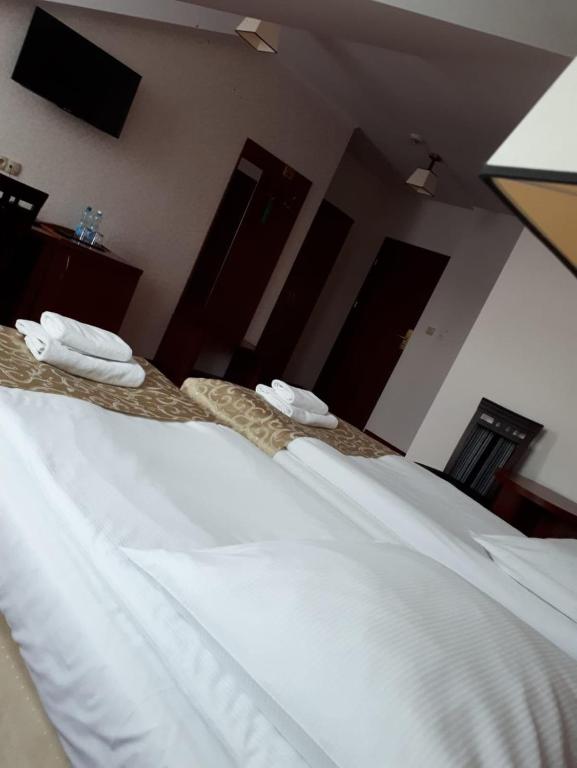 Posteľ alebo postele v izbe v ubytovaní Hotel Stara Gorzelnia