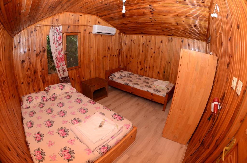 Postel nebo postele na pokoji v ubytování Olympos Camlık Pension