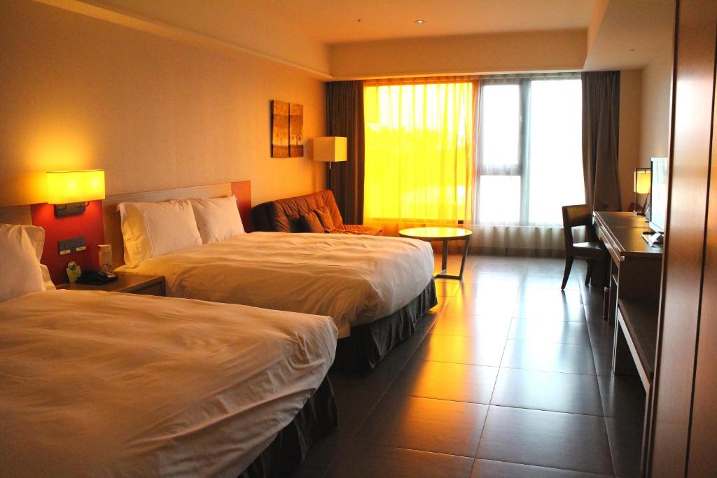 Postel nebo postele na pokoji v ubytování Fullon Hotel LihPao Resort