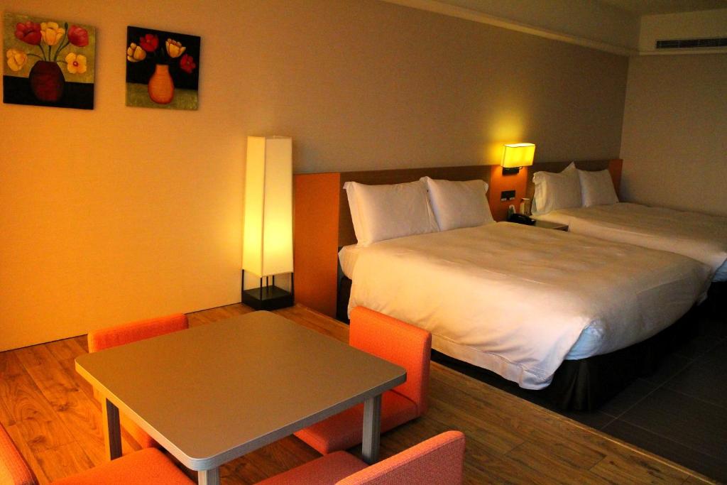 Postel nebo postele na pokoji v ubytování Fullon Hotel LihPao Resort