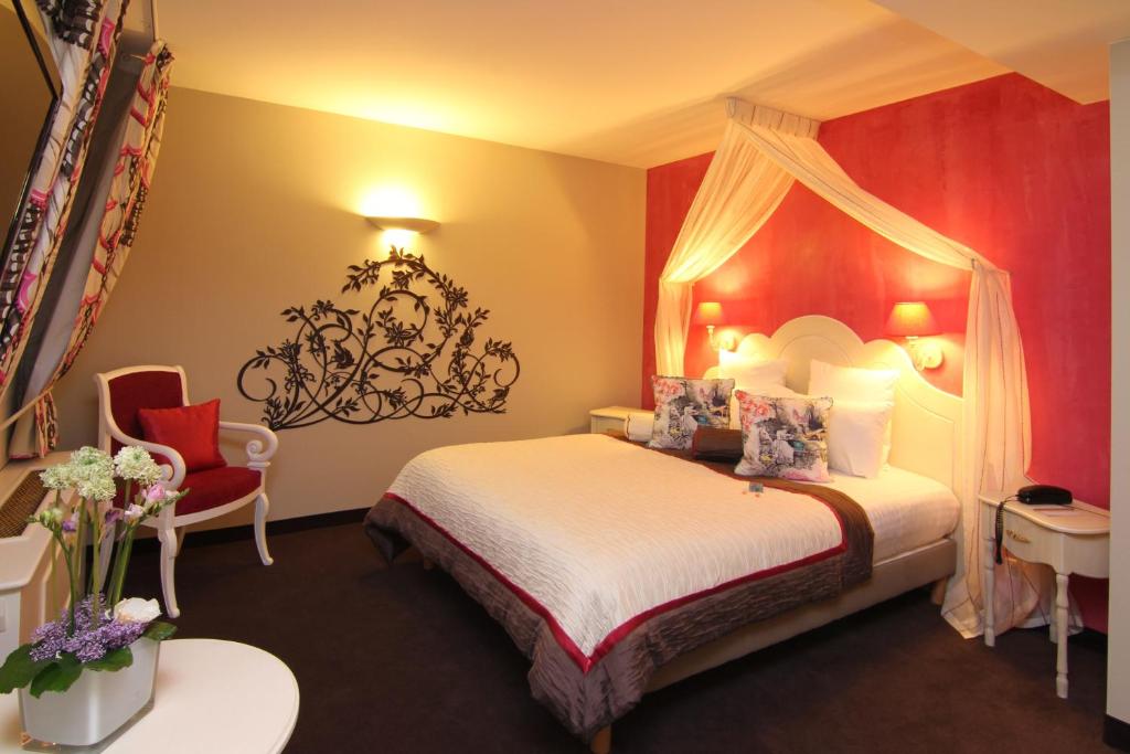 Postel nebo postele na pokoji v ubytování Hotel Beaucour