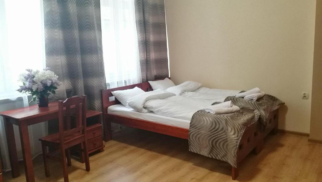 Posteľ alebo postele v izbe v ubytovaní Parkowa Rezydencja Hubal