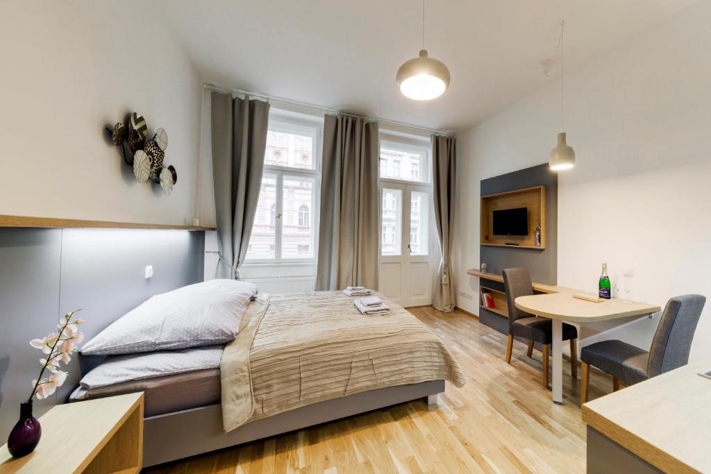 Postel nebo postele na pokoji v ubytování Maison Residence Prague