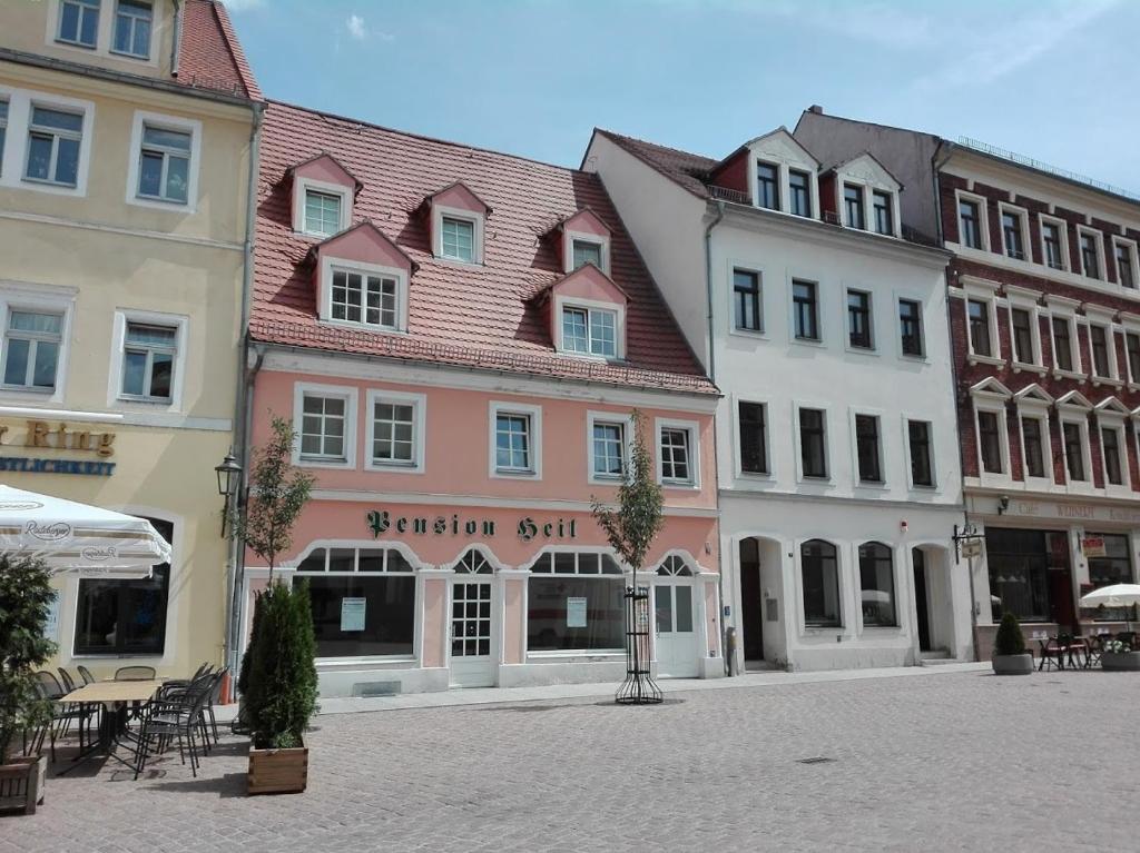 a group of buildings on a street in a city at Pension Anja Heil in Meißen