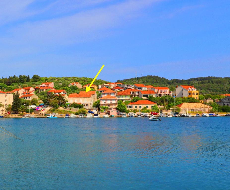 a town on the shore of a large body of water at Seaside Apartment Franica in Vela Luka