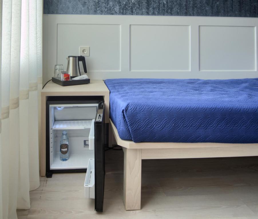 Postel nebo postele na pokoji v ubytování Hotel Luze El Villa