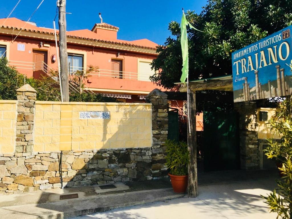a building with a sign that reads trilinano at Apartamentos Turisticos Trajano in Bolonia