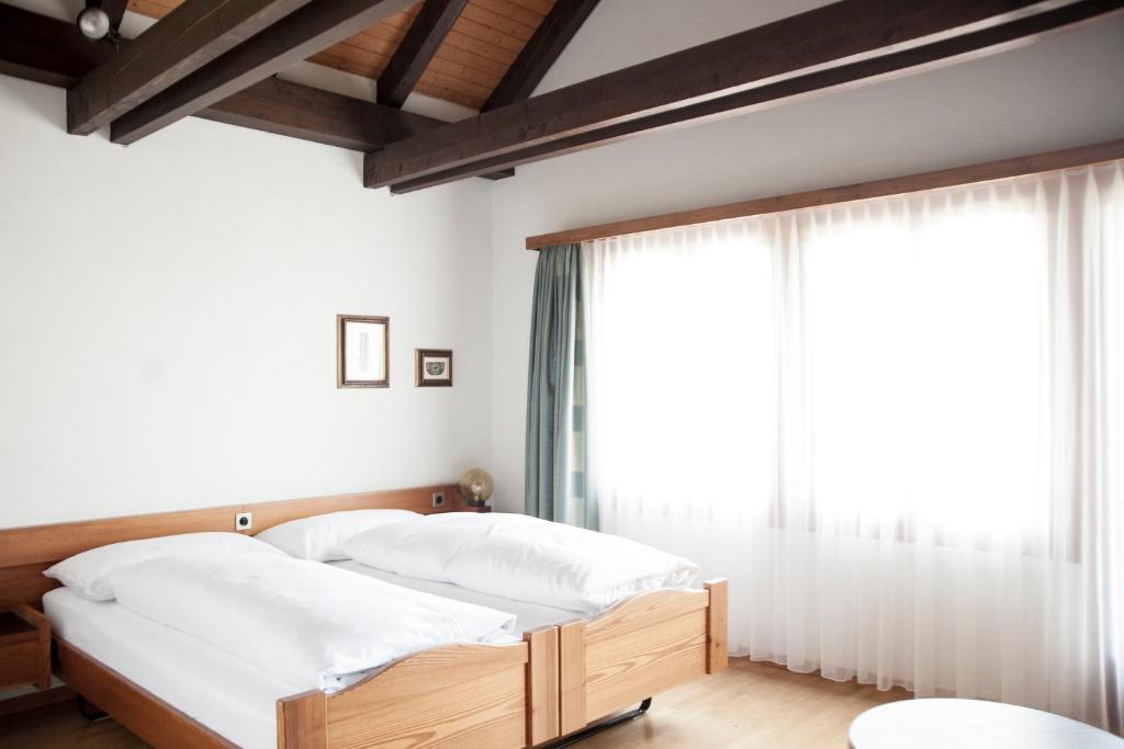 Postel nebo postele na pokoji v ubytování Hotel und Restaurant Wolfensberg