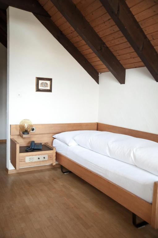 Postel nebo postele na pokoji v ubytování Hotel und Restaurant Wolfensberg