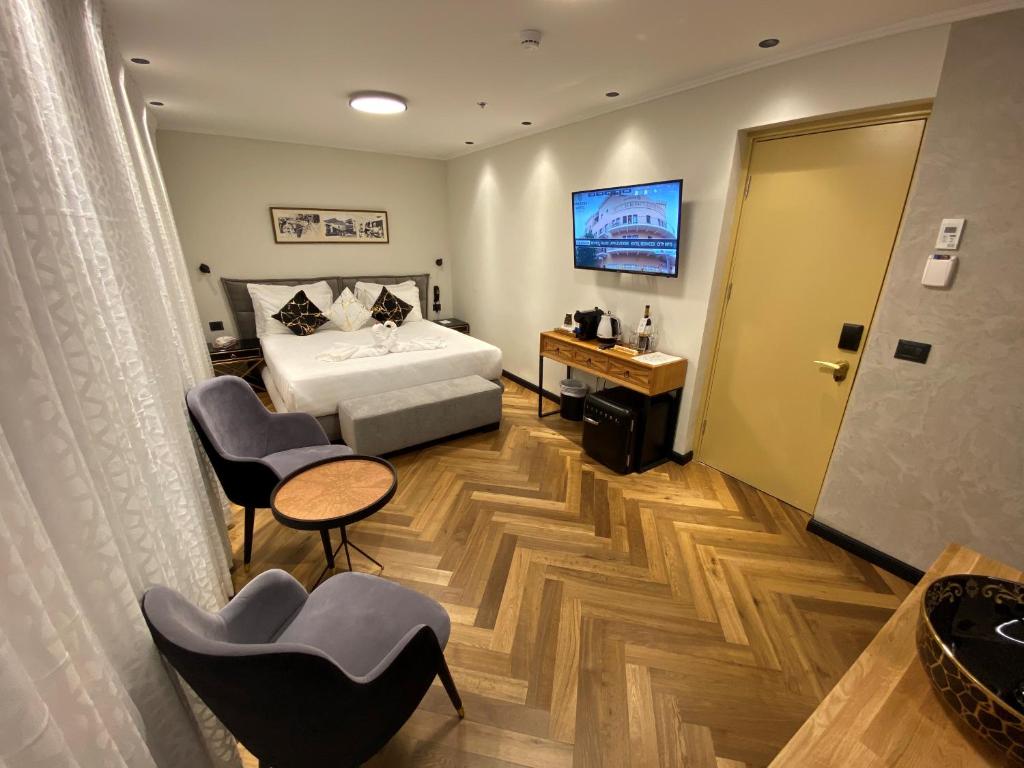 Postel nebo postele na pokoji v ubytování Margosa Boutique Hotel Tel-Aviv Jaffa