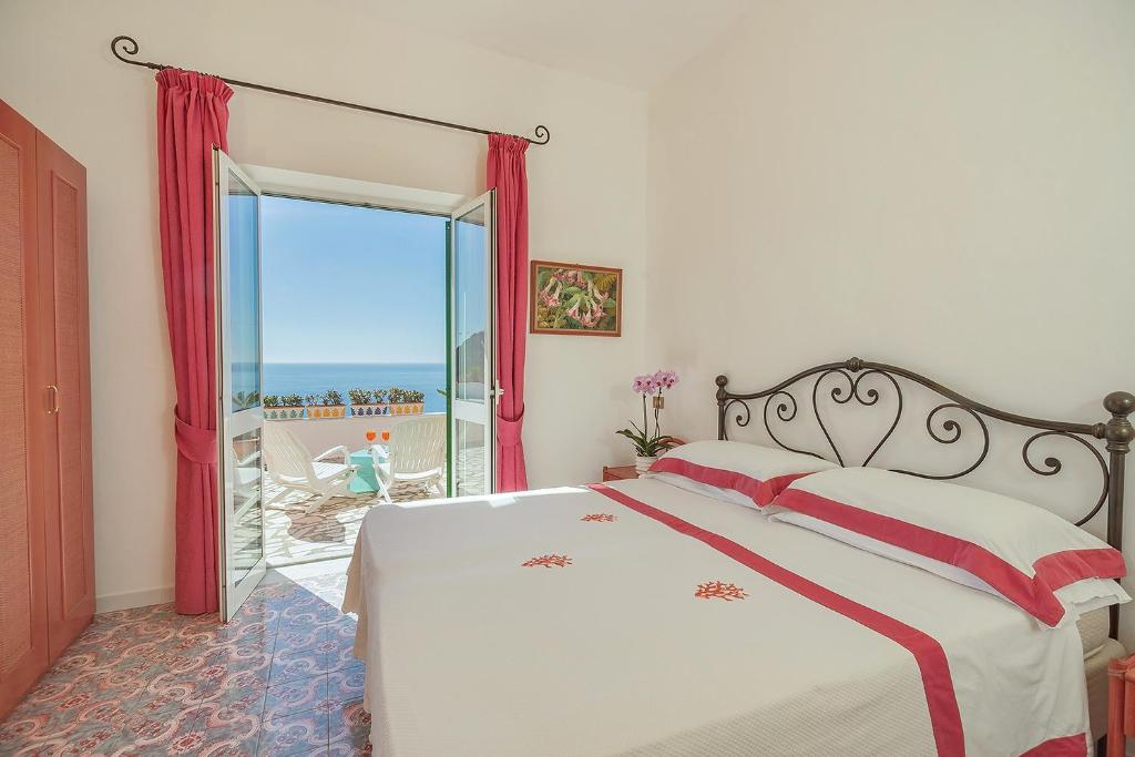 Postel nebo postele na pokoji v ubytování Hotel Villa Maria