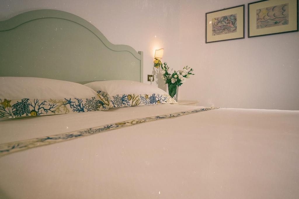 Postel nebo postele na pokoji v ubytování Hotel Villa Maria