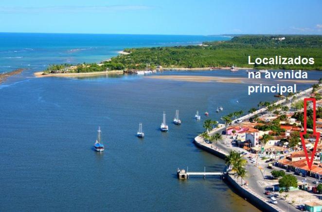 an aerial view of a harbor with boats in the water at Pousadinha- Melhor Localização in Porto Seguro