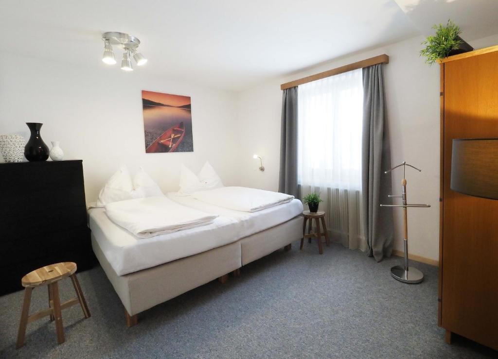 A bed or beds in a room at Pension Anni