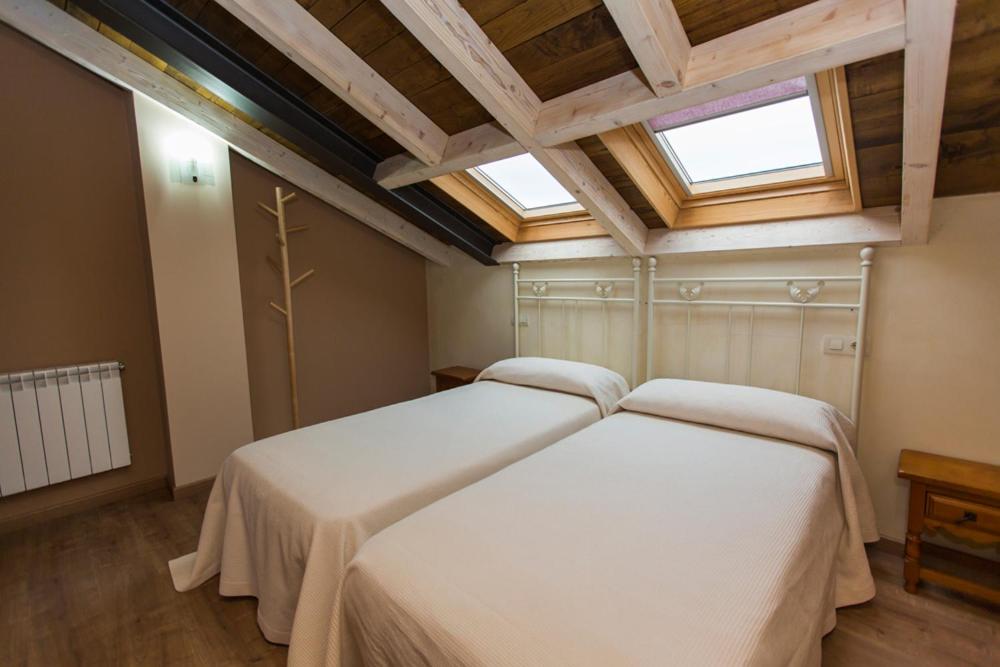 Postel nebo postele na pokoji v ubytování Apartamentos Casa Mateo