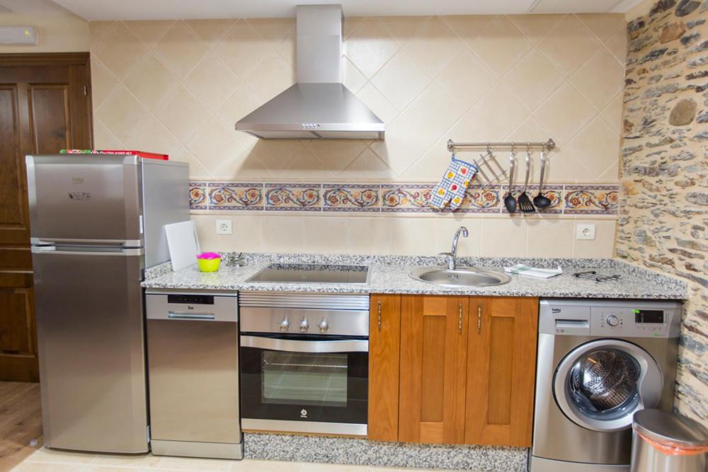 Kuchyň nebo kuchyňský kout v ubytování Apartamentos Casa Mateo