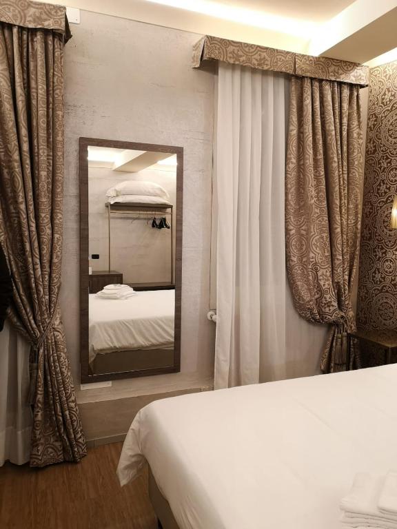Postel nebo postele na pokoji v ubytování Locanda Cavanella