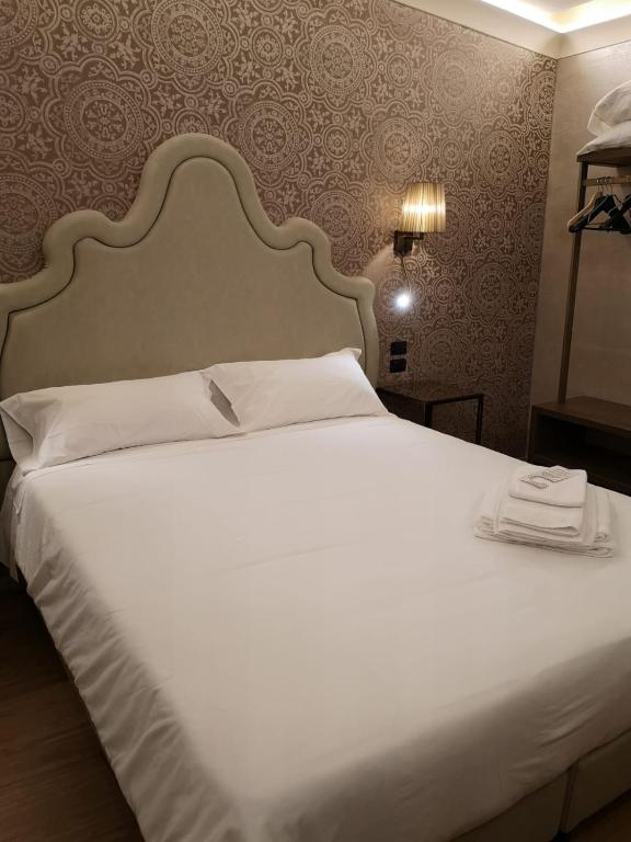Postel nebo postele na pokoji v ubytování Locanda Cavanella