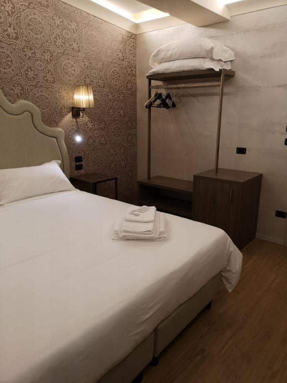 Postel nebo postele na pokoji v ubytování Locanda Cavanella