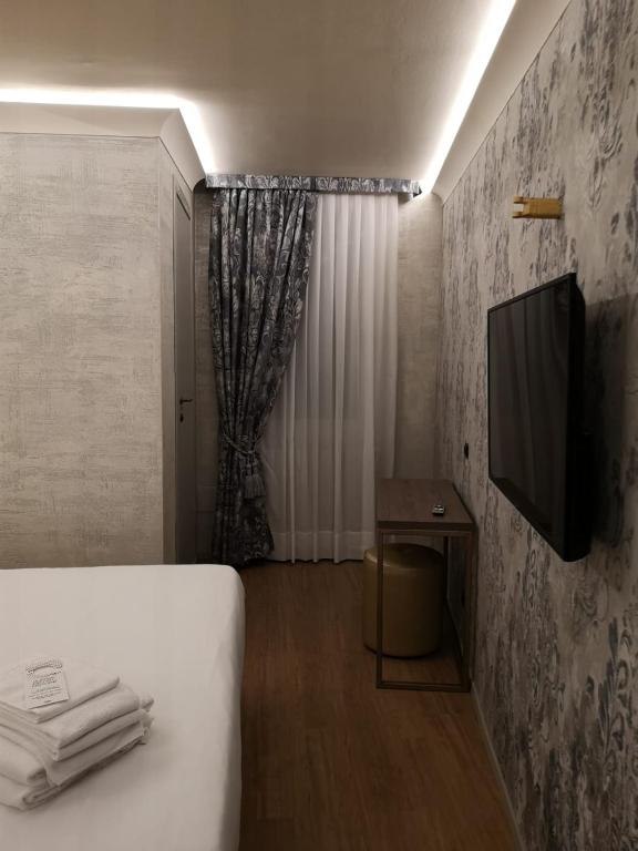 TV a/nebo společenská místnost v ubytování Locanda Cavanella